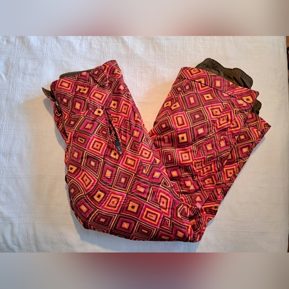 Obermeyer girls size 12 snow pants, diamond pattern orange, red & brown